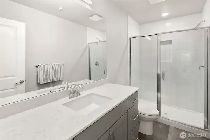 Primary bathroom, tile shower with built-in shelf!