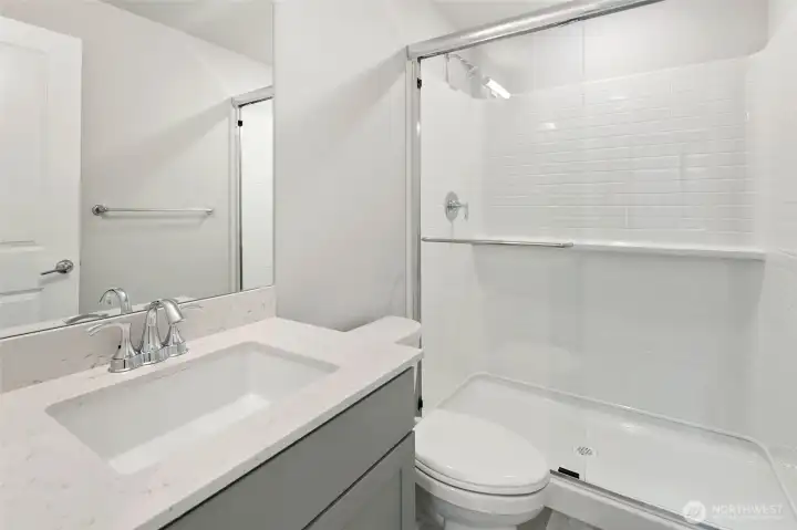 private bathroom downstairs, with a built-in shower shelf!