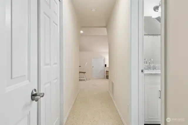 Hallway into the studio apartment. Closet on the left, full, 5-piece bathroom on the right