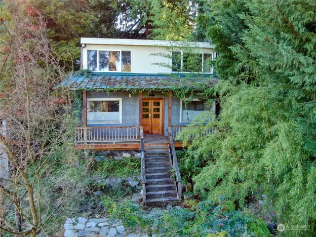 The existing house is perched for privacy from the street. And the mature landscape offers privacy from neighboring properties.