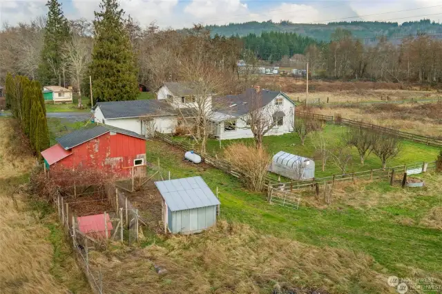 Back of main house and workshop. You can also see the 60 sq ft chicken coop in the foreground