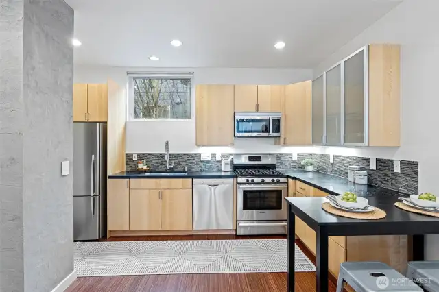 High end Bosch appliances and Fisher & Paykel fridge, Cosentino counter tops and glass backsplash are the highlights in this kitchen.