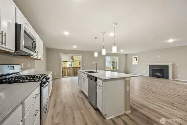Open concept living/dining/kitchen-Interior Pictures: Disclaimer- Photos are of another Finley floor plan from a previous community, photos are for illustrative purposes only. Finishes, flooring, upgrades, or other features may vary.