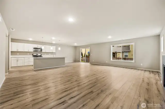 Open concept living/dining/kitchen-Interior Pictures: Disclaimer- Photos are of another Finley floor plan from a previous community, photos are for illustrative purposes only. Finishes, flooring, upgrades, or other features may vary.