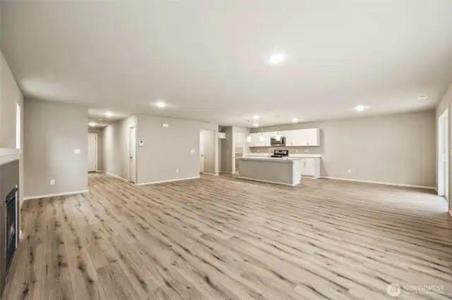 Open concept living/dining/kitchen-Interior Pictures: Disclaimer- Photos are of another Finley floor plan from a previous community, photos are for illustrative purposes only. Finishes, flooring, upgrades, or other features may vary.