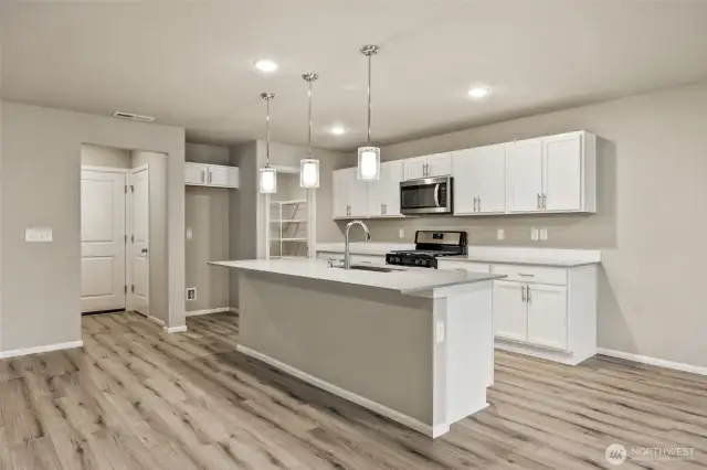 Open concept living/dining/kitchen-Interior Pictures: Disclaimer- Photos are of another Finley floor plan from a previous community, photos are for illustrative purposes only. Finishes, flooring, upgrades, or other features may vary.