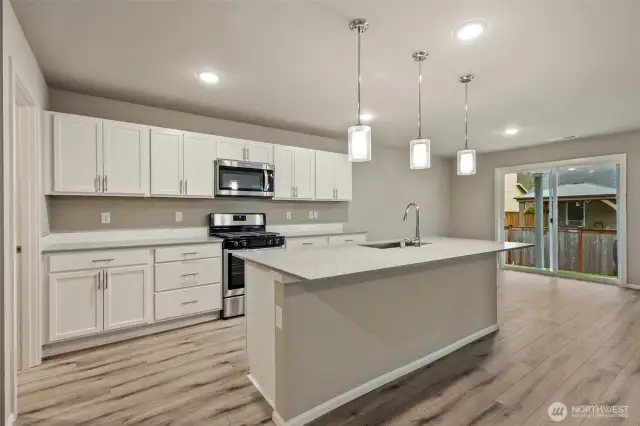 Open concept living/dining/kitchen-Interior Pictures: Disclaimer- Photos are of another Finley floor plan from a previous community, photos are for illustrative purposes only. Finishes, flooring, upgrades, or other features may vary.