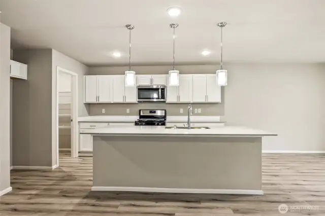 Open concept living/dining/kitchen-Interior Pictures: Disclaimer- Photos are of another Finley floor plan from a previous community, photos are for illustrative purposes only. Finishes, flooring, upgrades, or other features may vary.