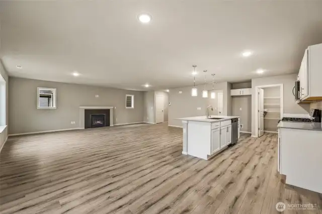 Open concept living/dining/kitchen-Interior Pictures: Disclaimer- Photos are of another Finley floor plan from a previous community, photos are for illustrative purposes only. Finishes, flooring, upgrades, or other features may vary.