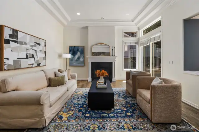 Living room with gas fireplace and access to deck.