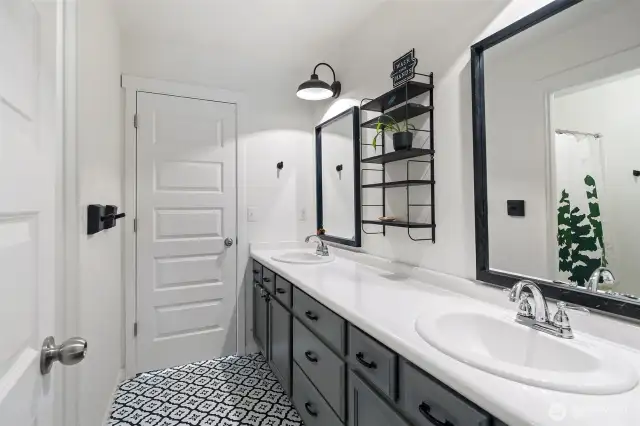 The guest bath, with double sinks and a HUGE vanity, has a separate toilet and shower room. There is Jack & Jill access from the guest bedrooms.