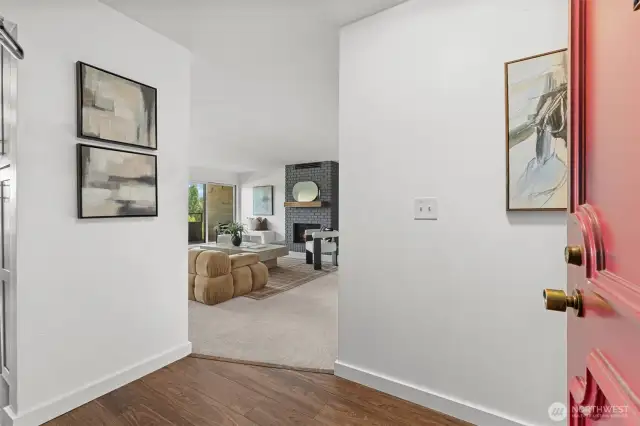 Clean lines and natural light greet you as you enter your new home. The living room and kitchen are to the left and the private wing en suite, second bedroom and full bath are to the right.