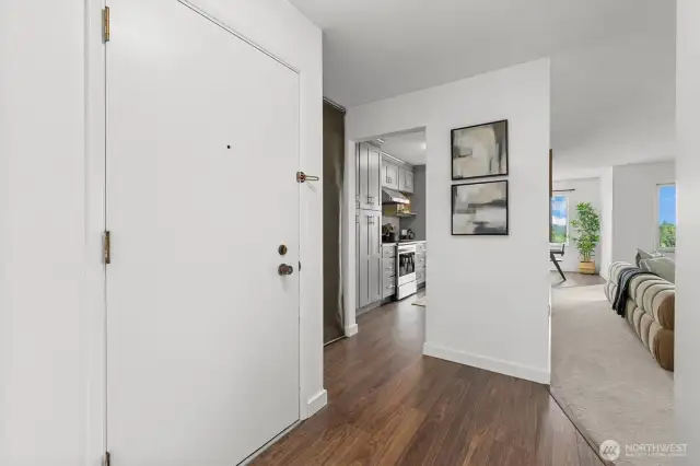 The open entryway offers ease of access and a seamless flow into the kitchen and main living spaces.