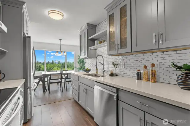 Clean cabinetry, subtle texture, and striking sightlines this modern kitchen is both beautifully efficient and visually connected to the view.