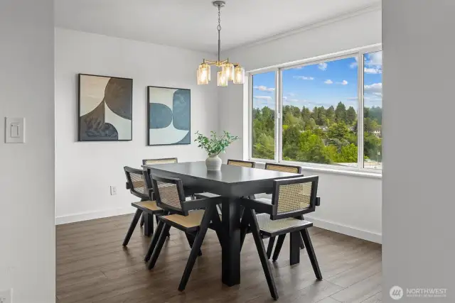 Spacious dining area with new laminate flooring.