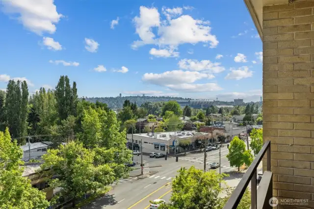 Huskey Stadium and the Space Needle from your private deck.
