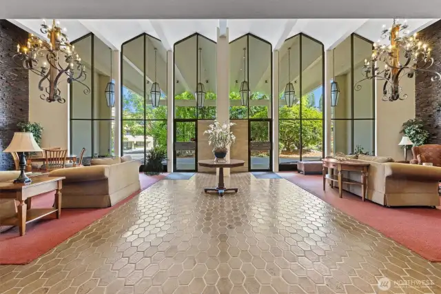 Grand mid-century lobby welcomes you with soaring ceilings, statement lighting, and inviting lounge areas where vintage charm meets everyday comfort.