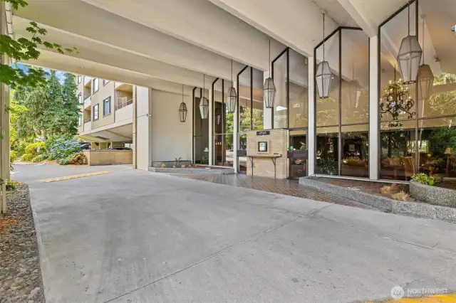 Level entry with covered drop-off leads directly to the lobby. No stairs between the front door and elevator for easy, everyday access.