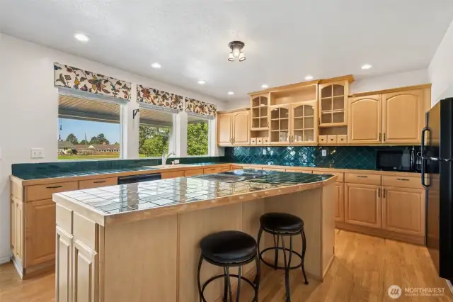 Nice sized kitchen with plenty of space for meal prep and breakfast bar.