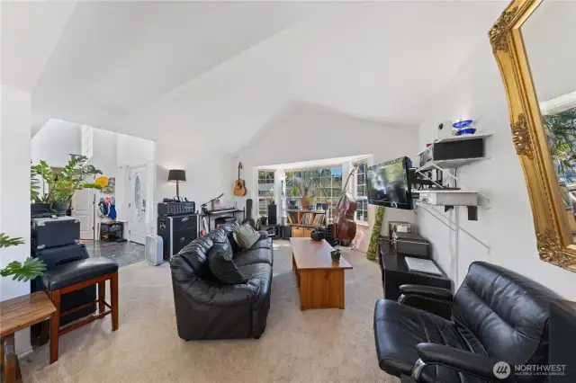 Enter the foyer with the office on the immediate right as you enter the home.  Light, bright vaulted ceilings and large picture windows for natural light.