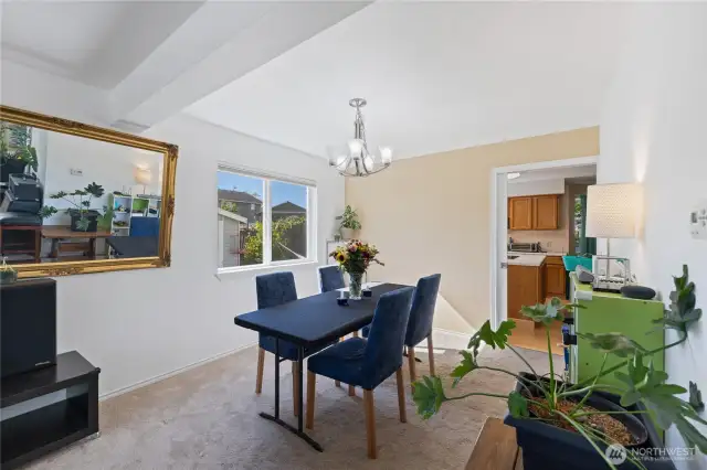 The formal dining room is large and open to the main living room space.  You can see the kitchen through the doorway at the far end.