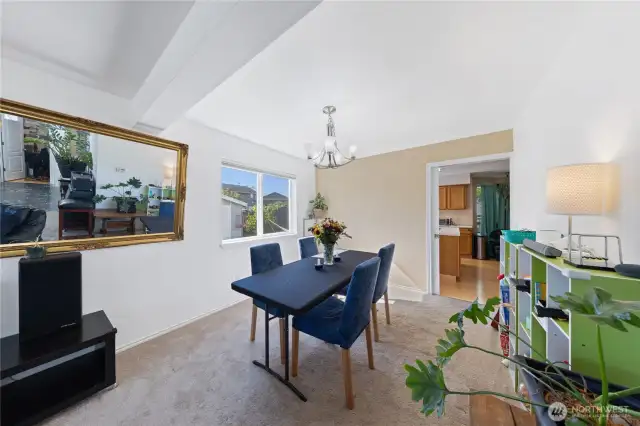 Here's another angel of the formal dining room and kitchen.  You can see the office off the foyer in the mirror.  That white door opens into the office with a window and closet.