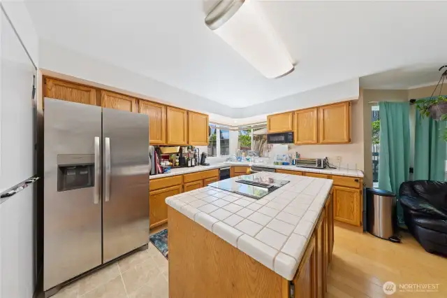 There are Bay windows and a slider to the entertaining deck and fenced back yard.  The Fridge is only 2 years old.