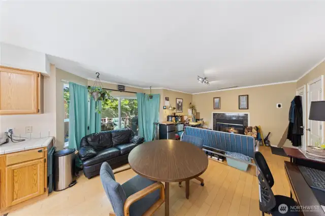 This photo shows the large windows and slider access to the large entertaining, newly painted decking where you can BBQ and relax with friends.