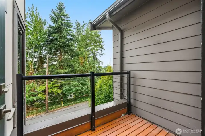 Covered deck with peekaboo views of the Lake- staircase to the right of the photo, leads you to the rooftop deck