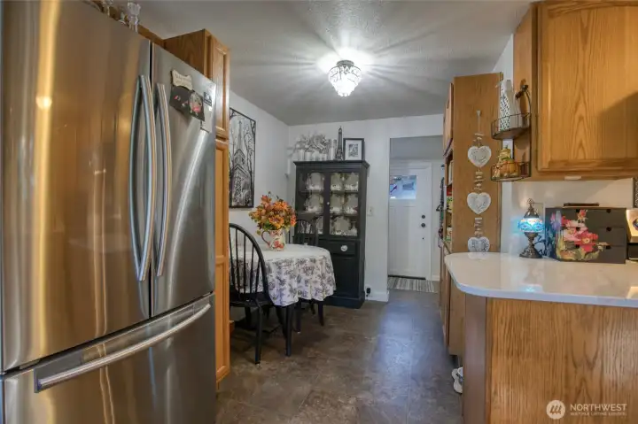 Looking from kitchen to dining room to bathroom and back door