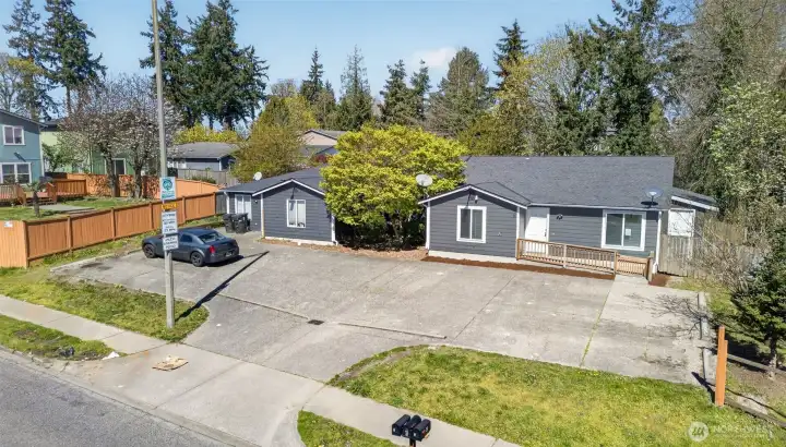 The property comprises two 4-bedroom, 2-bathroom units and one 5-bedroom, 2-bathroom unit, offering diverse rental market appeal.