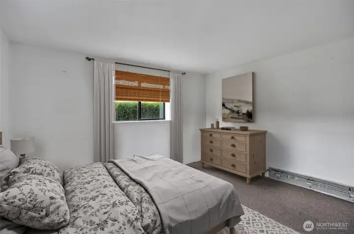 Lower-level bedroom. This photo has been virtually staged.