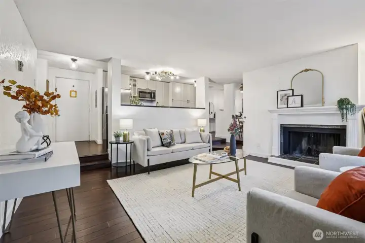 Front door with view of Kitchen, sunken Living Room with Fireplace