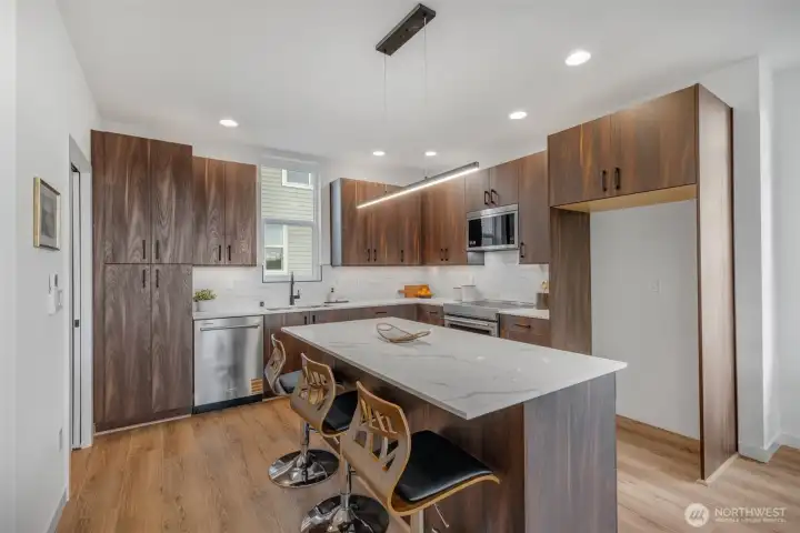 There is so much cabinet/counter top space in this kitchen!   Photos are of model home of same floorplan. Color schemes will vary.