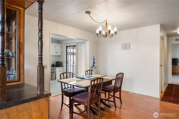 The dining area. The slider door at the end of the kitchen leads out onto a spacious, private, fully covered patio
