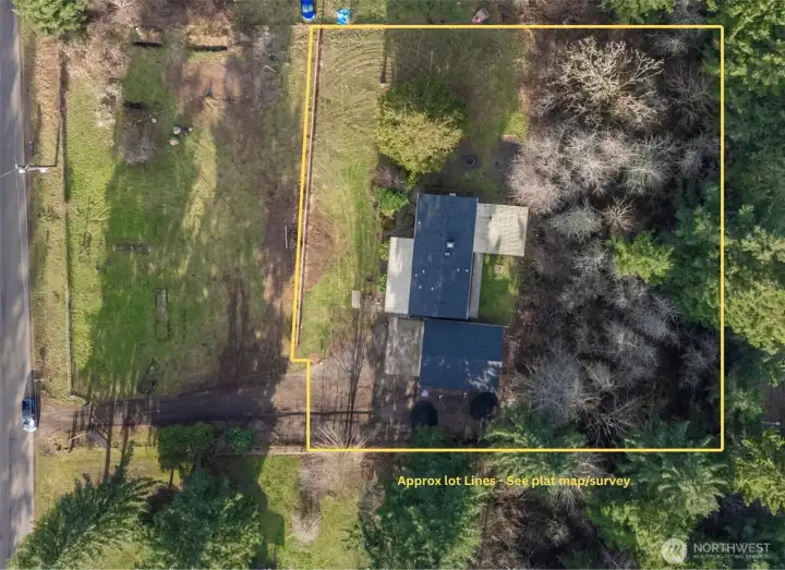Overhead perspective showcases the expansive lot of nearly an acre, with no neighbors in the back!