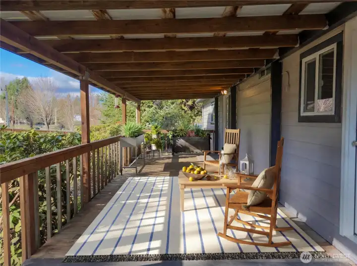 Inviting covered front porch provides the perfect spot to relax, entertain, and enjoy peaceful country surroundings.