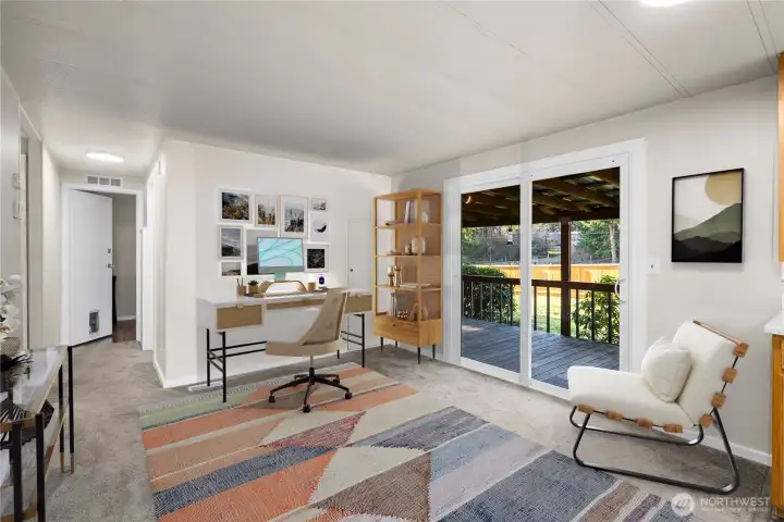 Flexible space just off the covered front porch offers endless possibilities for a home office, den, or creative hobby room.    (photo virtually staged)