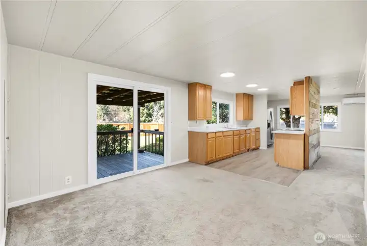 Open-concept flex space beside the kitchen creates a functional, connected area for dining, office, or additional living.