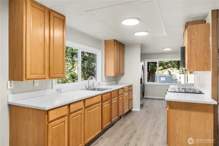 Open-concept kitchen features updated finishes, generous counter space, and a layout designed for easy everyday living.