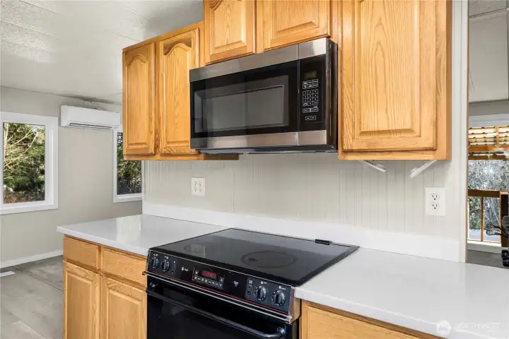 Updated kitchen includes modern appliances, clean finishes, and efficient design for cooking and entertaining.