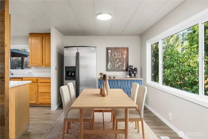 Open dining area off the kitchen provides a comfortable space for meals while staying connected to the home’s main living areas.  (photo virtually staged)