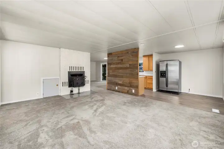 Large open living area highlights the home’s flowing layout with easy access to the kitchen and dining spaces.