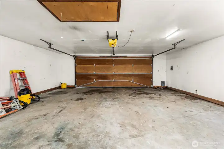Garage interior offers ample room for vehicles, storage, hobbies, or workshop use.