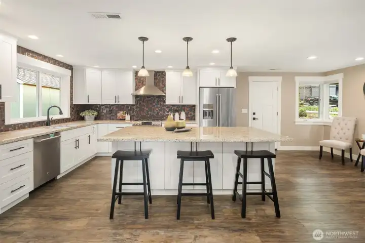 Fresh trim and craftsman doors, and LVP flooring throughout. Newer Milgard Tuscany vinyl windows, two-way blinds, newer 95% efficiency furnace and water heater. Newer outlets, fixtures and recessed lighting.