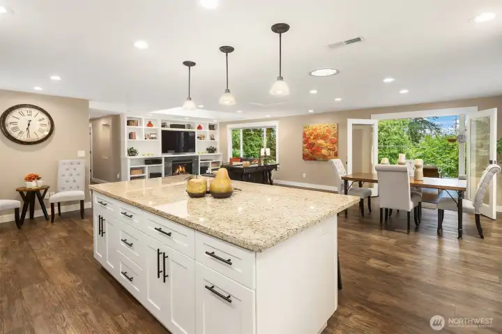 Exceptional sightlines connects all the day-to-day living areas including the dining area and living room off off the kitchen, and French doors to the back yard.