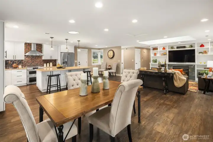 Exceptional sightlines connects all the day-to-day living areas including the dining area and living room off off the kitchen, and French doors to the back yard.