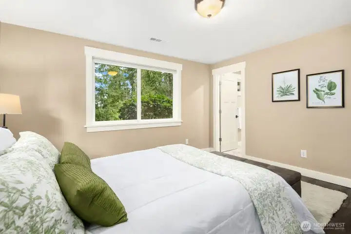 Generous primary bedroom with en suite bath.