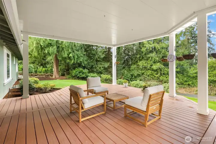 Adjacent to the living area are French doors that lead to the partially covered composite deck.