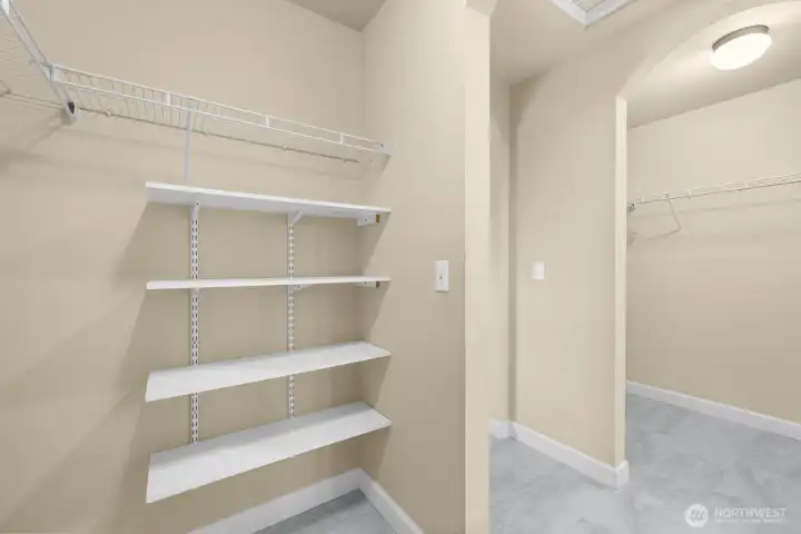 Walk-in primary closets - one on each side!